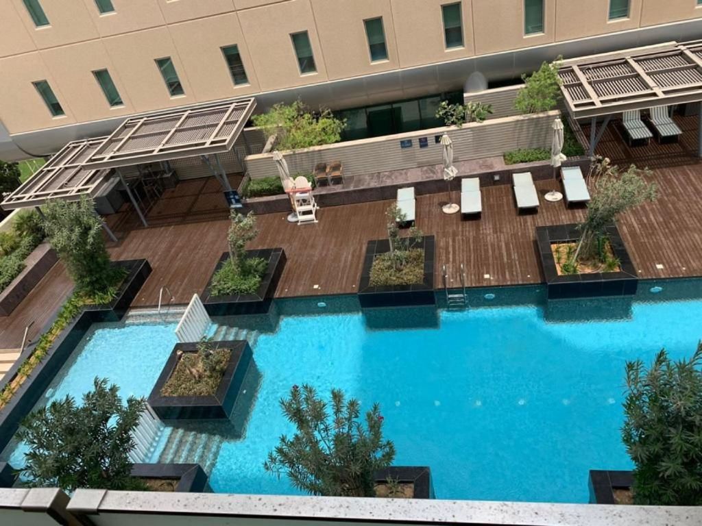 1BR Apt | Balcony and Pool View | Rent Refund